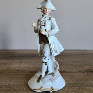 Vintage porcelain figurine. Gentleman holding a rose. 8'' tall.